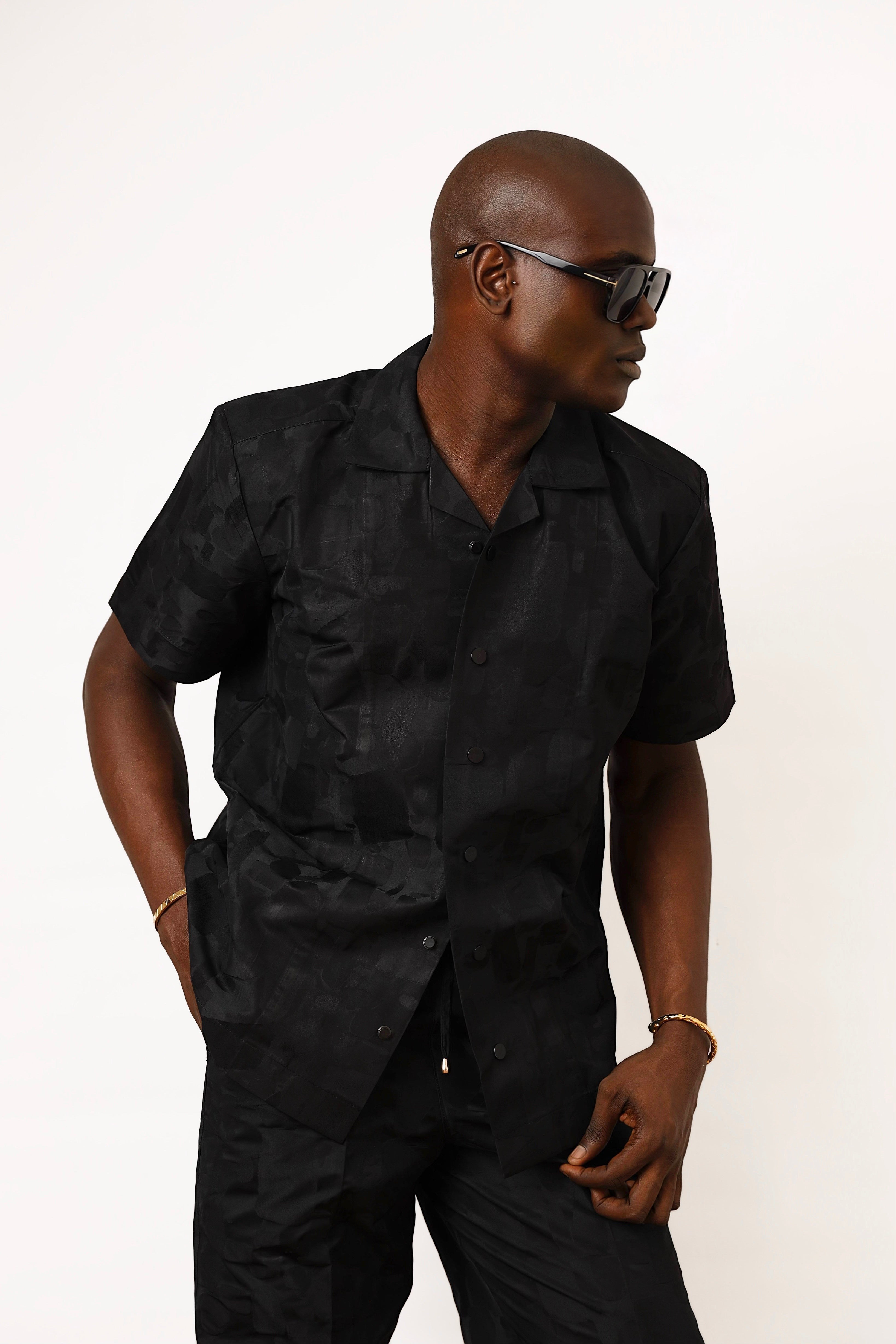 Shop Frugal black brocade Cuban shirt with a relaxed fit and textured weave. Model wears size L.