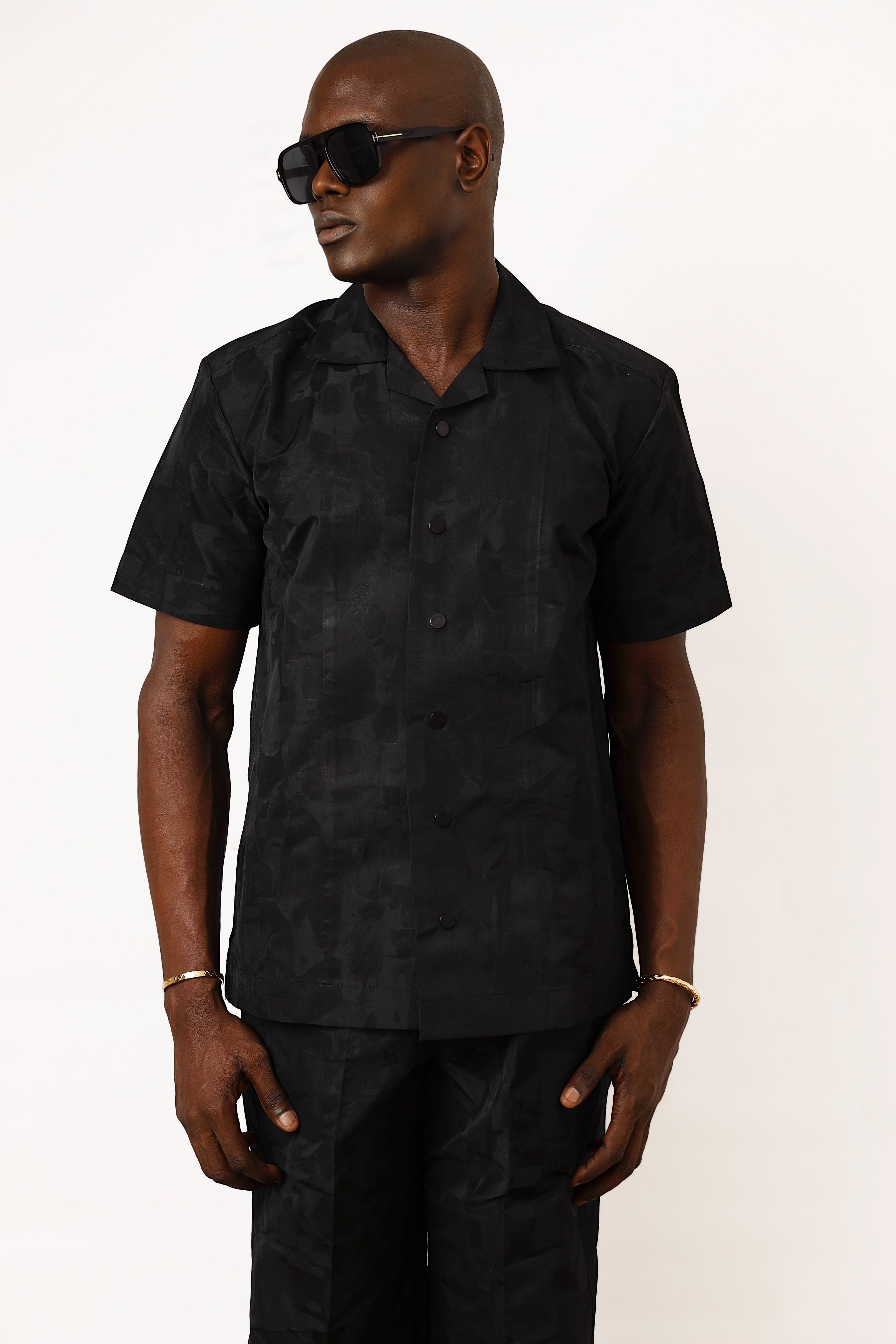 Shop Frugal black brocade Cuban shirt with a relaxed silhouette and textured weave. Model wears size L.